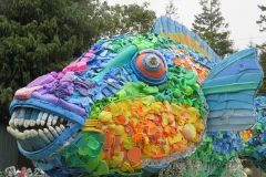 The colorful parrotfish sculpture is made entirely of ocean plastic trash.