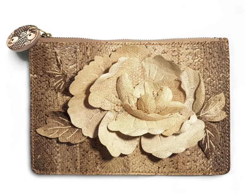 A clutch bag made from fish skin, decorated with a large flower created with collaged shapes cut from fish leather.