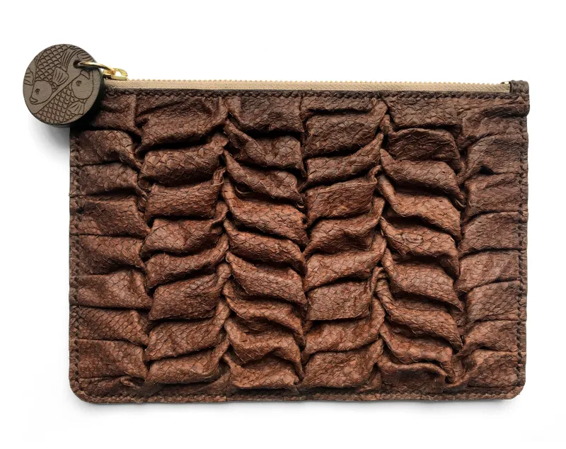 A clutch bag made from fish skin that is folded into ruffle patterns.